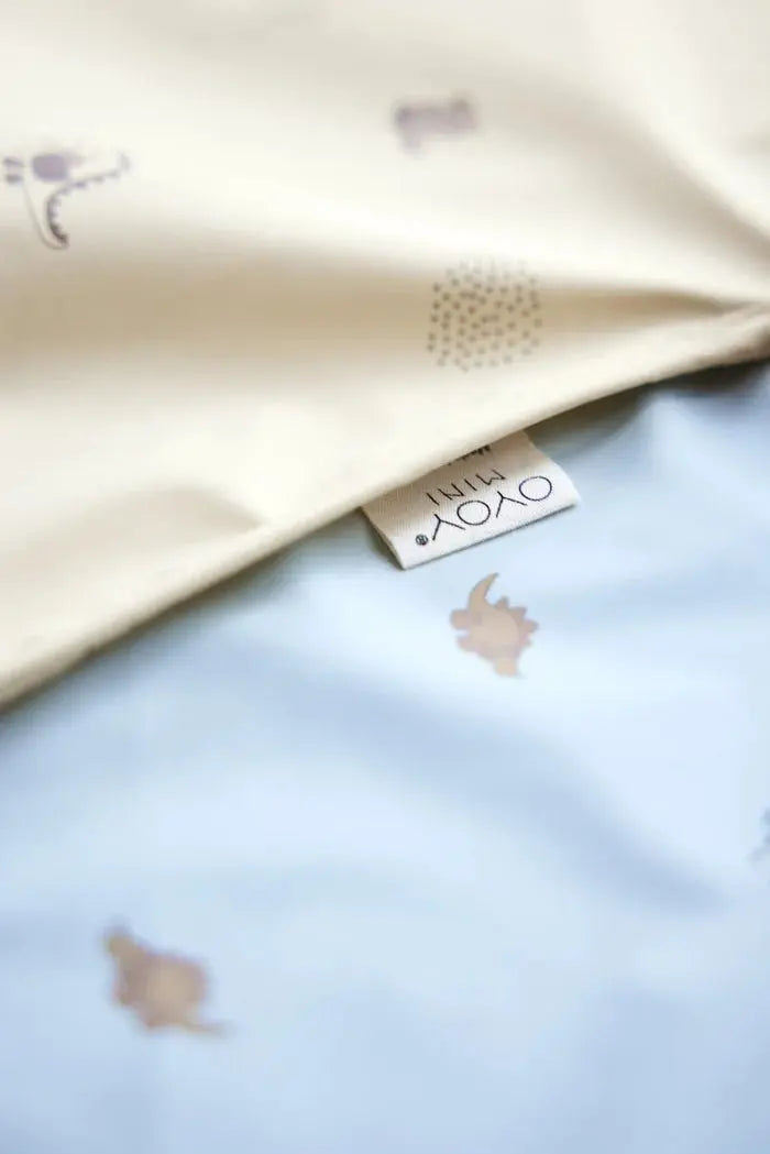 Dino Waterproof Cape Bib In Butter  OYOY   