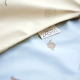 Dino Waterproof Cape Bib In Butter  OYOY   